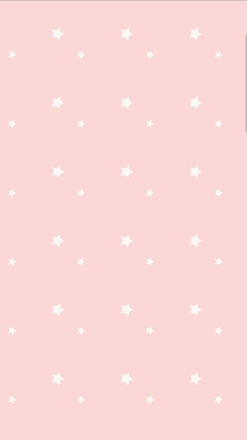 Cute Stars 桌布 壁紙 — 柔和的粉紅色背景，點綴著散落的白色星星，大小各異。