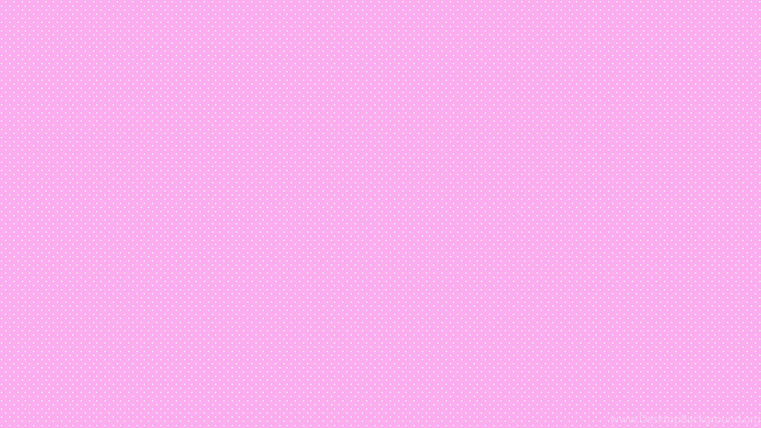 Simple Pink 桌布 壁紙 — 柔和的粉紅色背景帶有微妙的重複圓點圖案，營造出溫和而平靜的視覺質感。