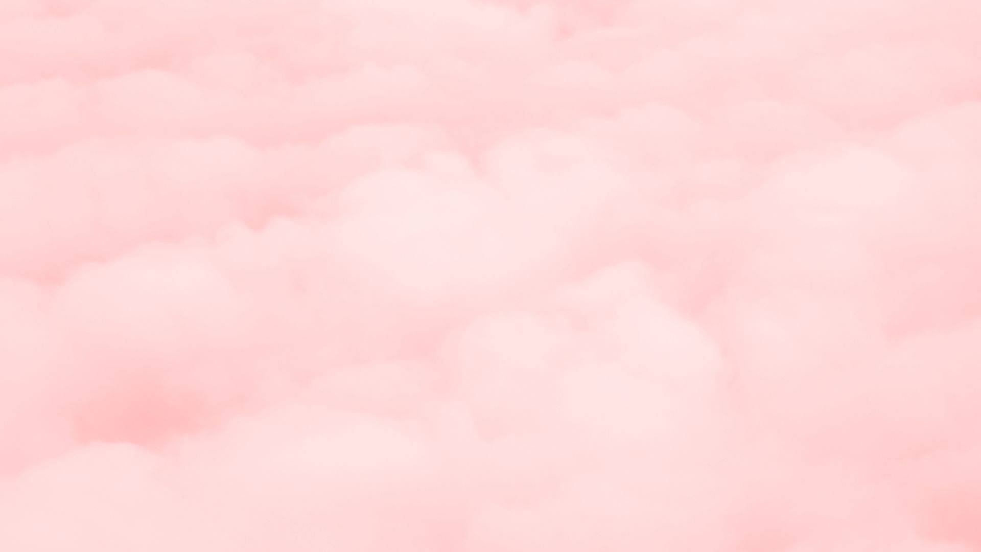 雲朵 桌布 壁紙 — 柔和的粉紅雲朵在夢幻的天空中輕輕飄動，帶有微妙的漸變和模糊的邊緣。