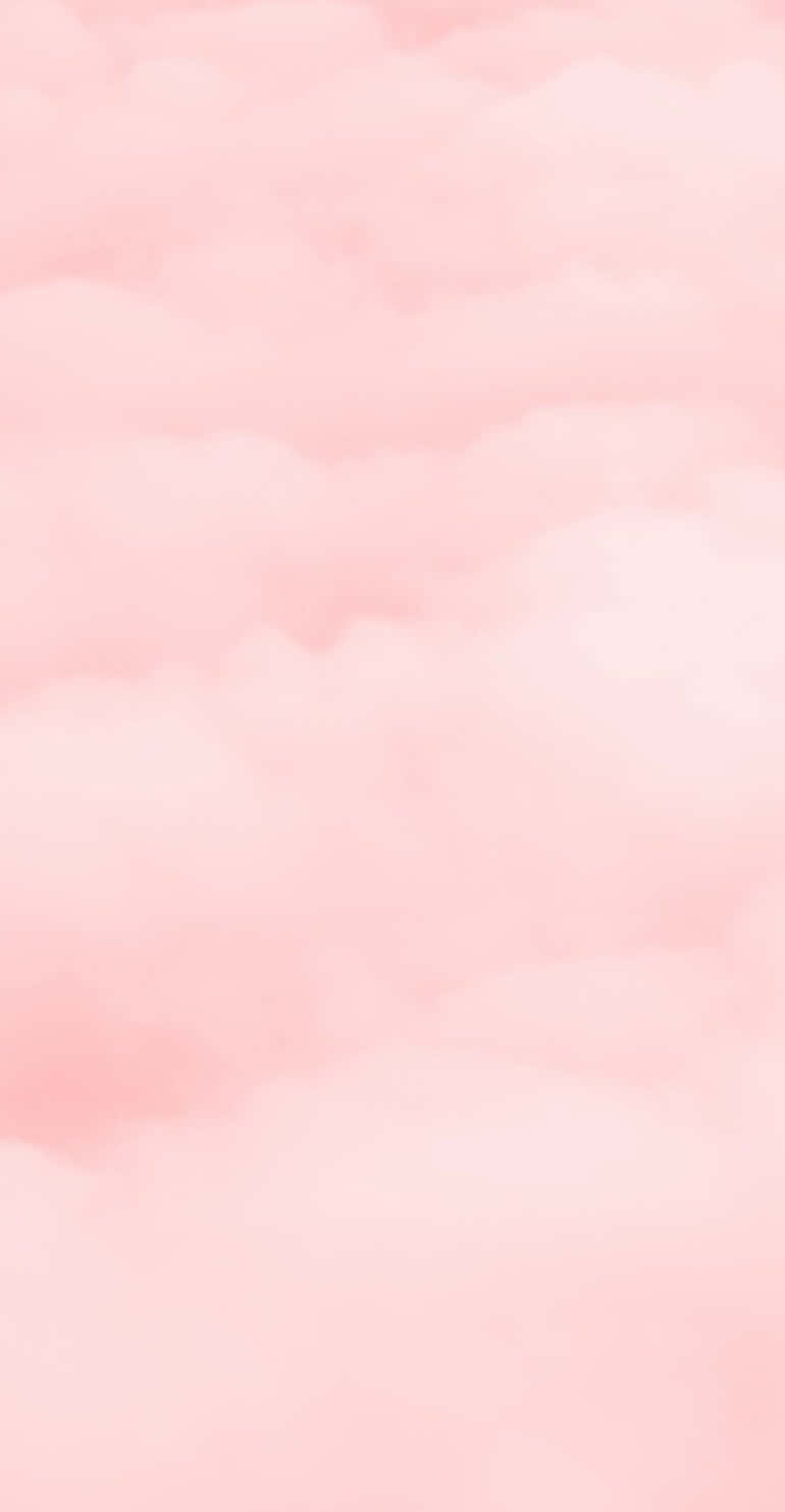 Soft 桌布 壁紙 — 柔和的粉紅雲朵在夢幻的粉彩天空中輕輕飄動，呈現寧靜的水彩洗滌效果。
