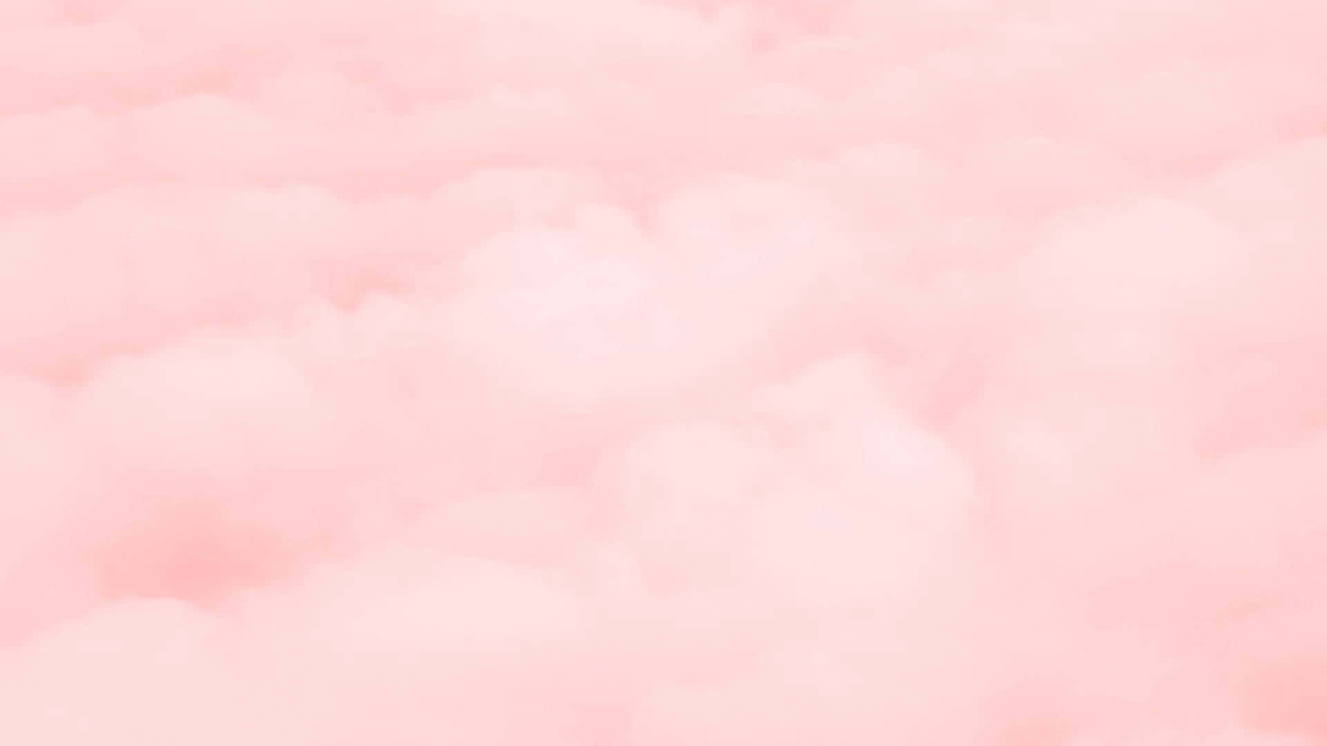 淺粉紅 桌布 壁紙 — 柔和的粉紅雲朵在夢幻般的天空中輕輕飄動，帶有微妙的漸變色調。