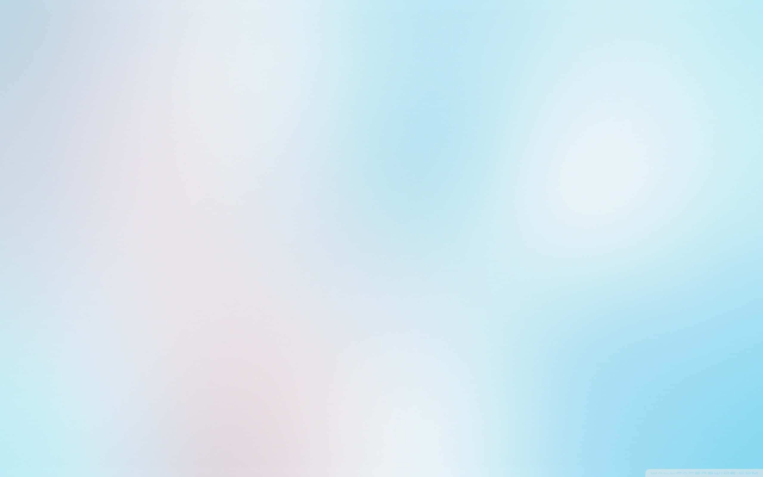 風景 桌布 壁紙 — 柔和的粉藍色和白色漸變，加上柔和的光暈，營造出寧靜的數位背景。