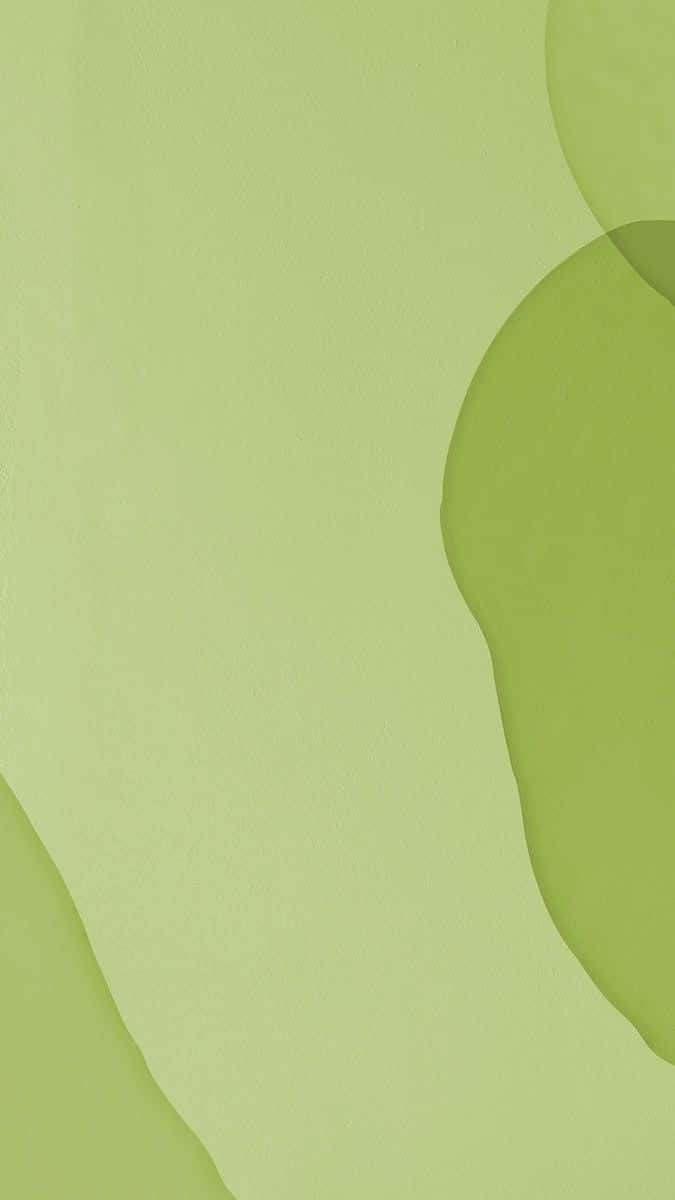 Olive Green 桌布 壁紙 — 柔和的綠色抽象形狀在柔和的萊姆色背景上輕輕流動，構成極簡數位藝術作品。