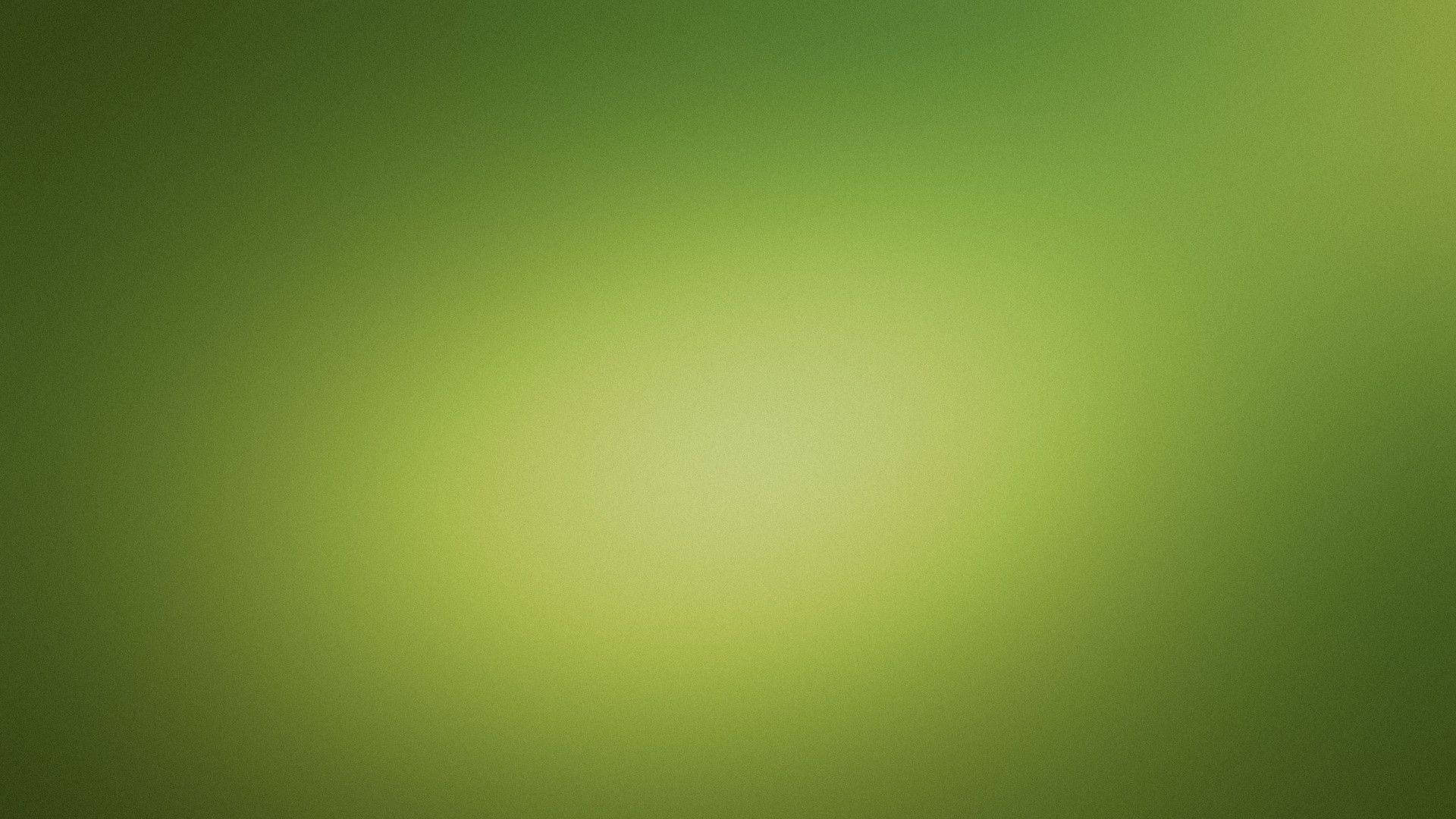 綠色 桌布 壁紙 — 柔和的綠色色調漸變從明亮的中心向較暗的邊緣擴散，營造出平靜的抽象背景。