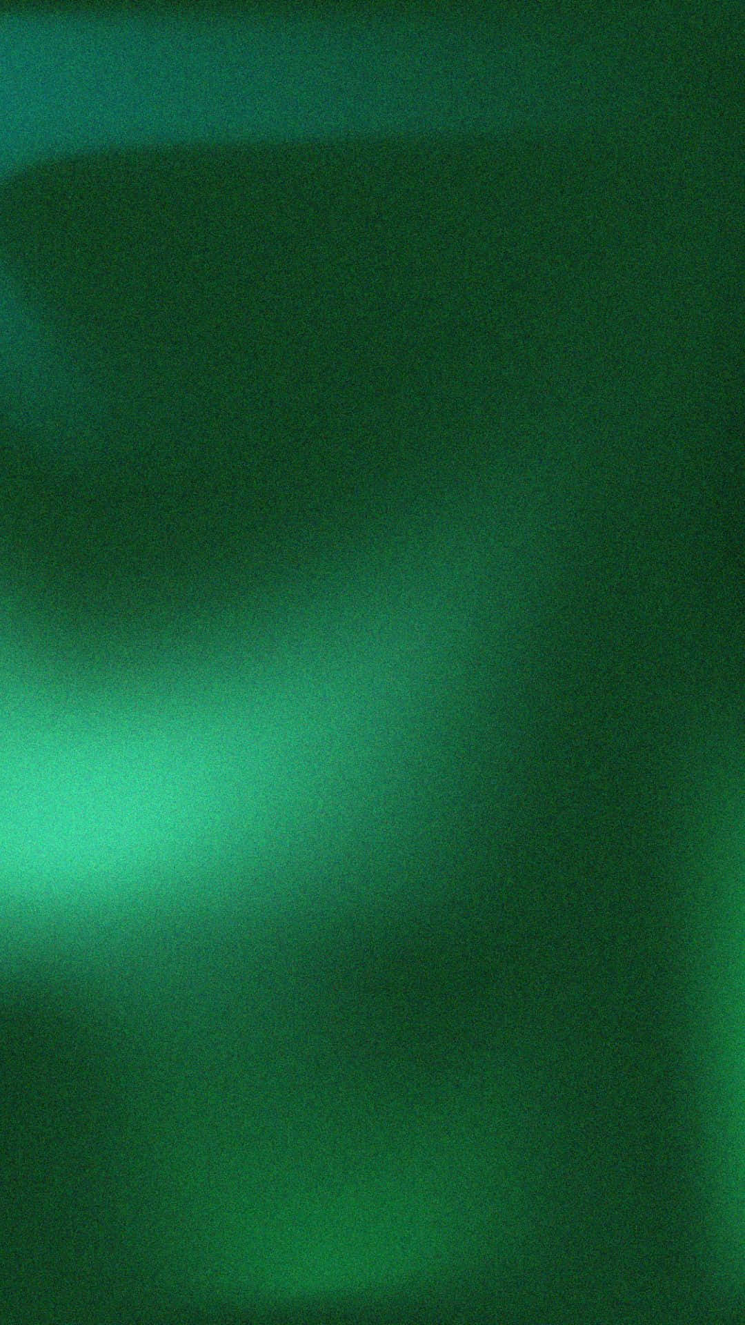 Green Gradient 桌布 壁紙 — 柔和的翡翠綠色漸變，搭配微妙的燈光變化，營造出平靜的抽象光芒。