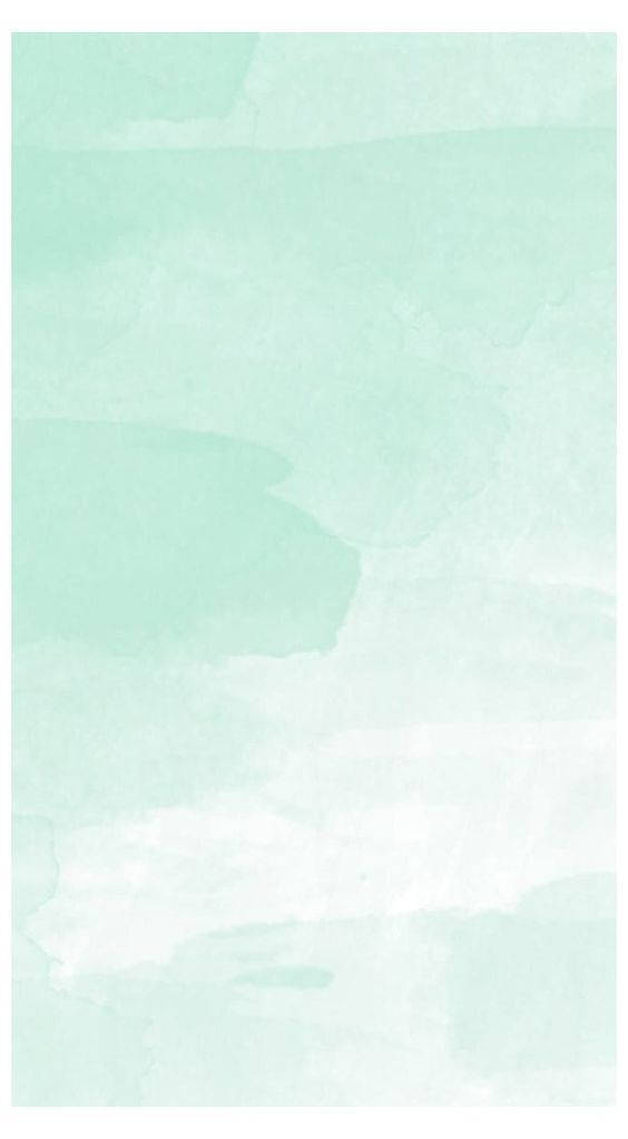 Mint Green iPhone 桌布 壁紙 — 柔和的薄荷綠色水彩洗滌在紋理紙上輕輕混合，營造出寧靜簡約的抽象背景。