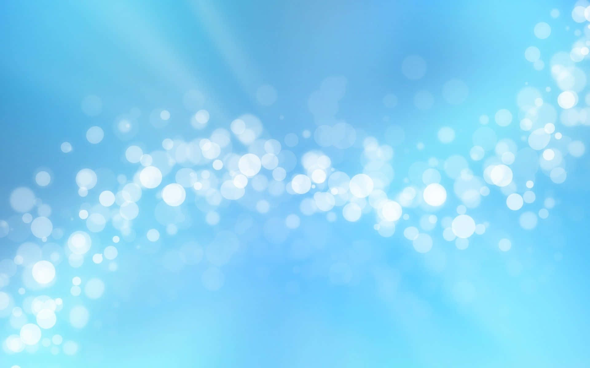 Bokeh 桌布 壁紙 — 柔和的藍色漸層背景，散落著發光的白色散景燈光，營造出夢幻空靈的氛圍。