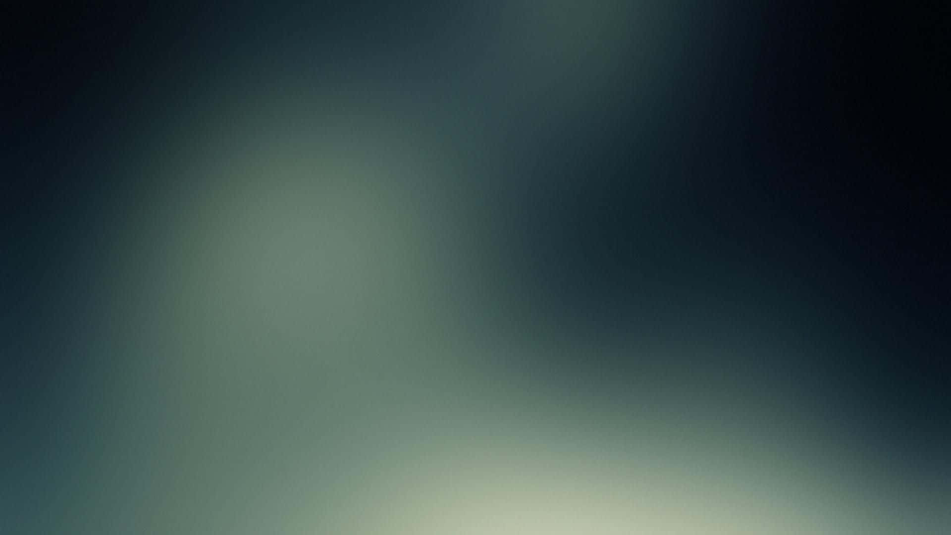 桌布 壁紙 — 柔和的青綠色和深藍色漸變，帶有發光的光點，營造出寧靜的抽象背景。