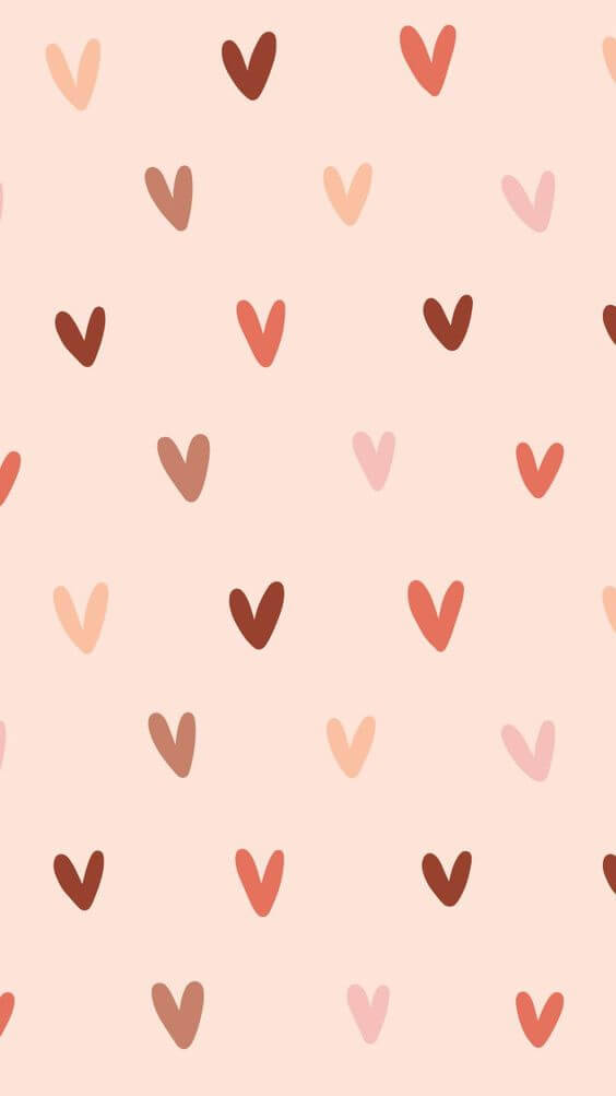 cute girly phone 桌布 壁紙 — 柔和粉彩壁紙，淺粉紅色背景上散佈著手繪心形圖案，採用溫暖大地色調。