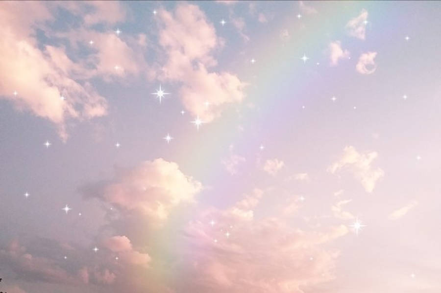 雲朵 桌布 壁紙 — 柔和粉彩的天空，有蓬鬆的雲朵、溫柔的彩虹和閃爍的星星，營造出夢幻的天體場景。