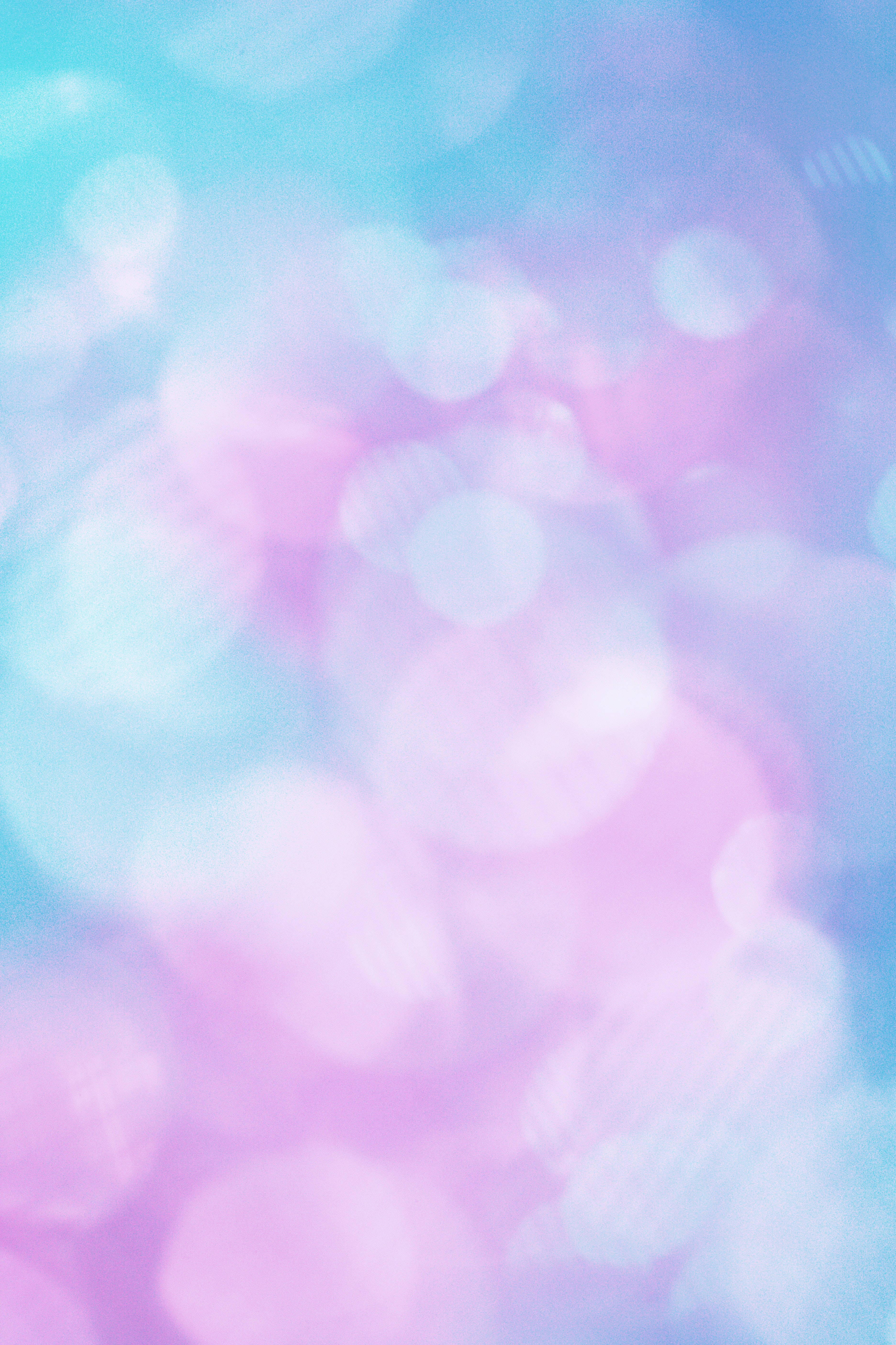 Screen 桌布 壁紙 — 柔和粉彩粉紅和藍色散景燈光，營造出夢幻般的抽象背景，帶有柔和發光的圓圈。