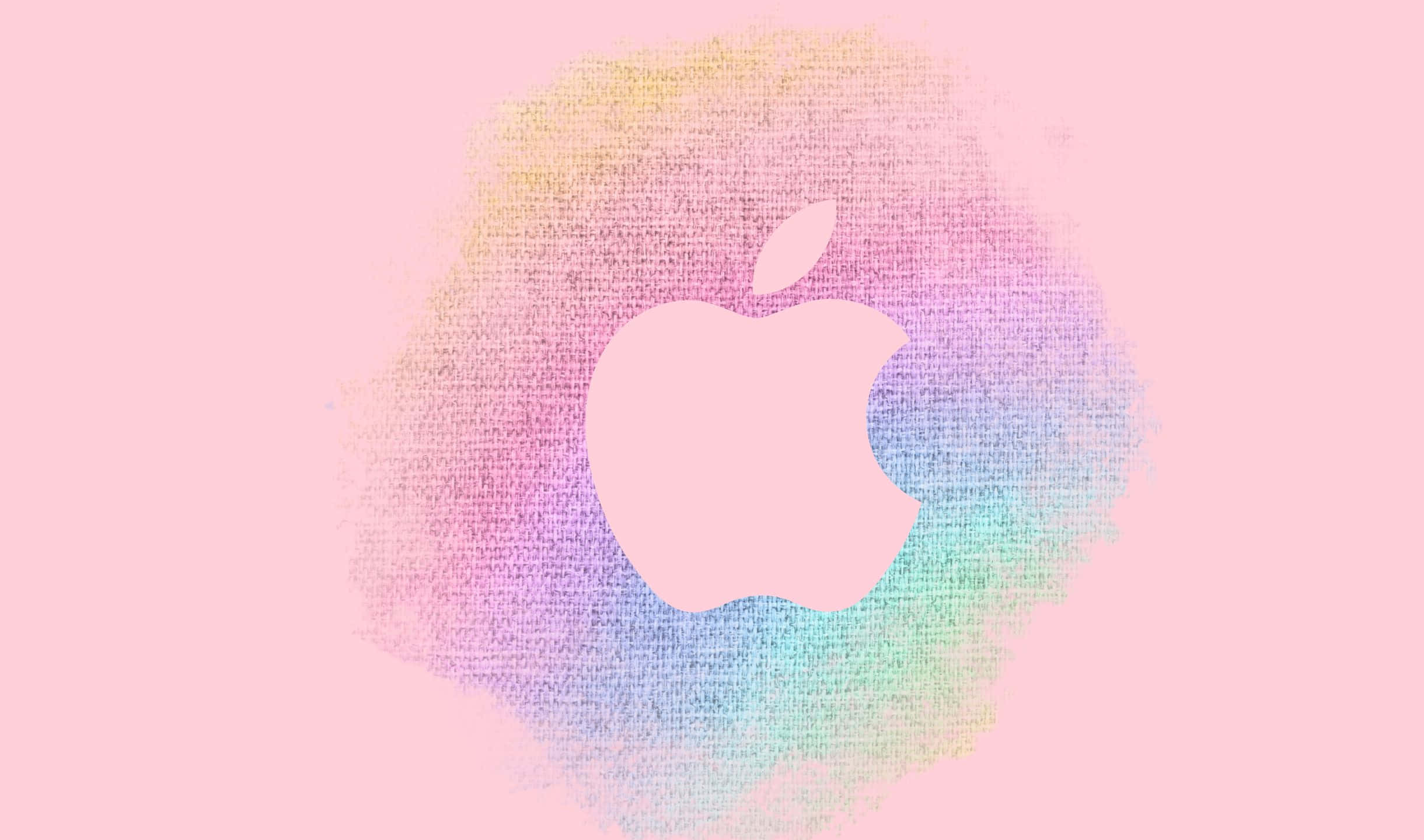 2440x1440 Apple 桌布 壁紙 — 柔和粉紅色 Apple 標誌居中於淺粉紅色背景上的粉彩彩虹水彩潑濺。