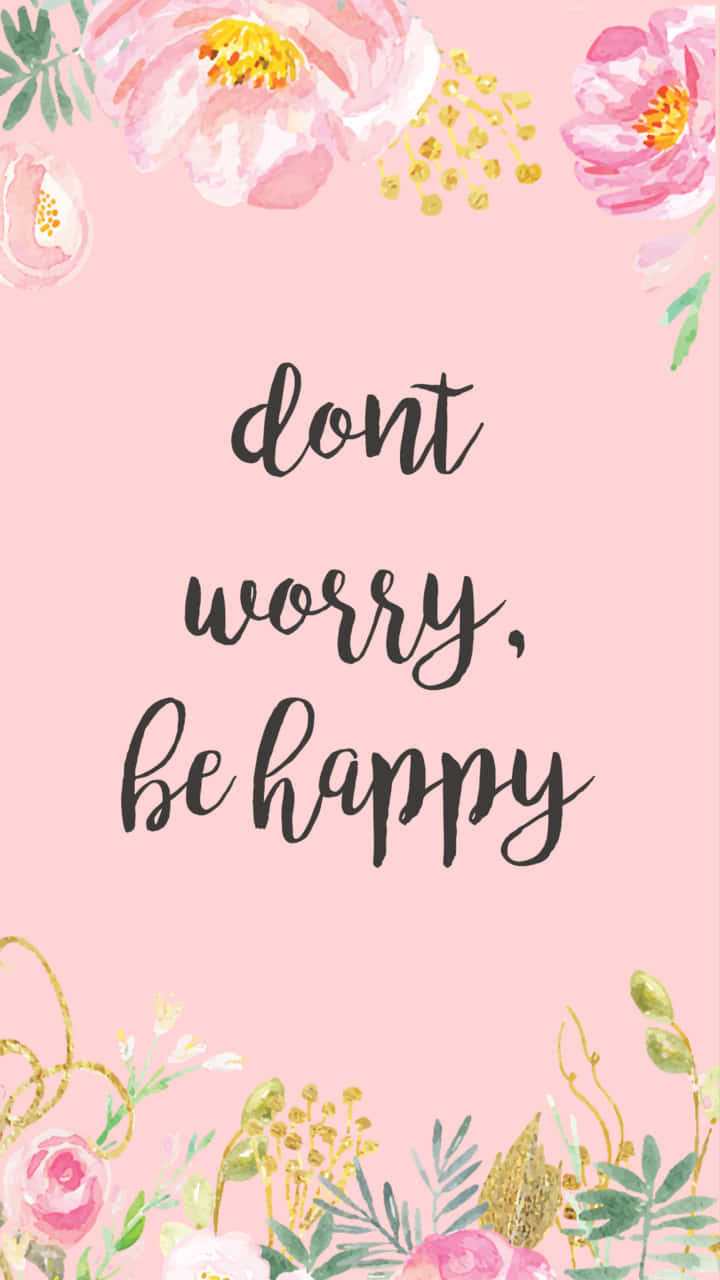 Dont Worry Be Happy 桌布 壁紙 — 柔和粉紅色背景，飾有水彩花卉和金色點綴，環繞著手寫短語 dont worry be happy。