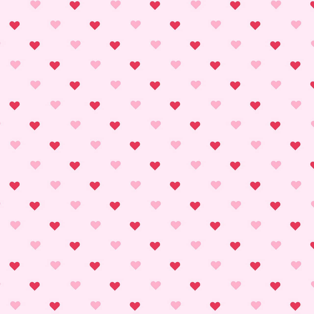 Heart Pattern 桌布 壁紙 — 柔和粉紅色背景，飾有重複的小紅心和淺粉紅心形圖案。