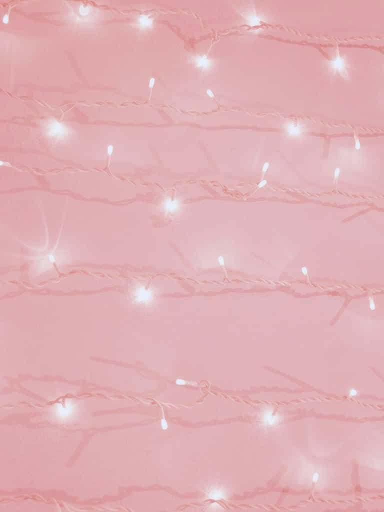Cute Aesthetic iPad 桌布 壁紙 — 柔和粉紅色背景，點綴著發光的白色燈串，營造溫馨節日氛圍。