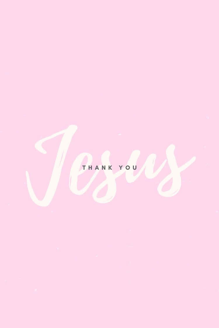 Pink Cross 桌布 壁紙 — 柔和粉紅色背景上，以大型白色草書寫著「Jesus」一字，下方有小型大寫字母「THANK YOU」。