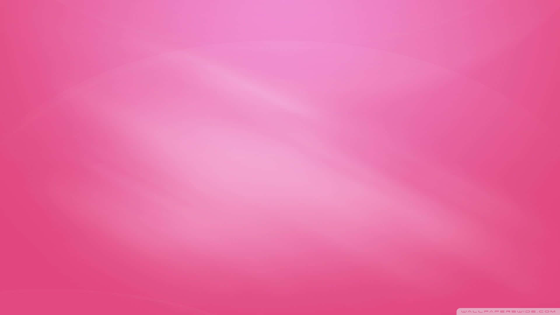 Solid Pink 桌布 壁紙 — 柔和粉紅色調的漸層輕輕流過框架，營造出平靜的抽象背景。