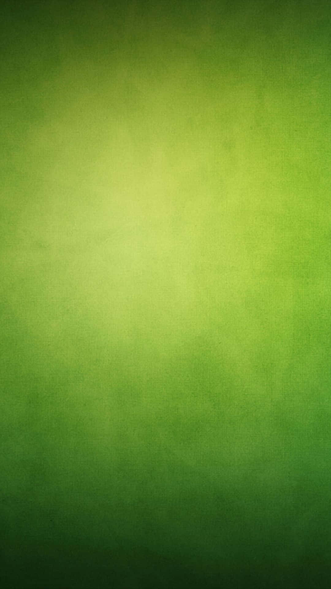 Green Color 桌布 壁紙 — 柔和綠色漸變背景，帶有細微紋理，光線從中心向邊緣漸淡。