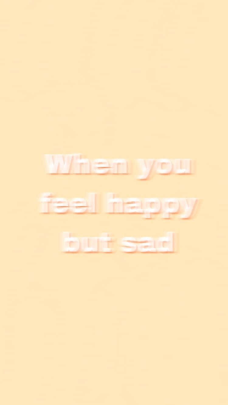 Chill Aesthetic 桌布 壁紙 — 柔和蜜桃色背景，以柔和白色字體顯示「When you feel happy but sad」的微妙文字。