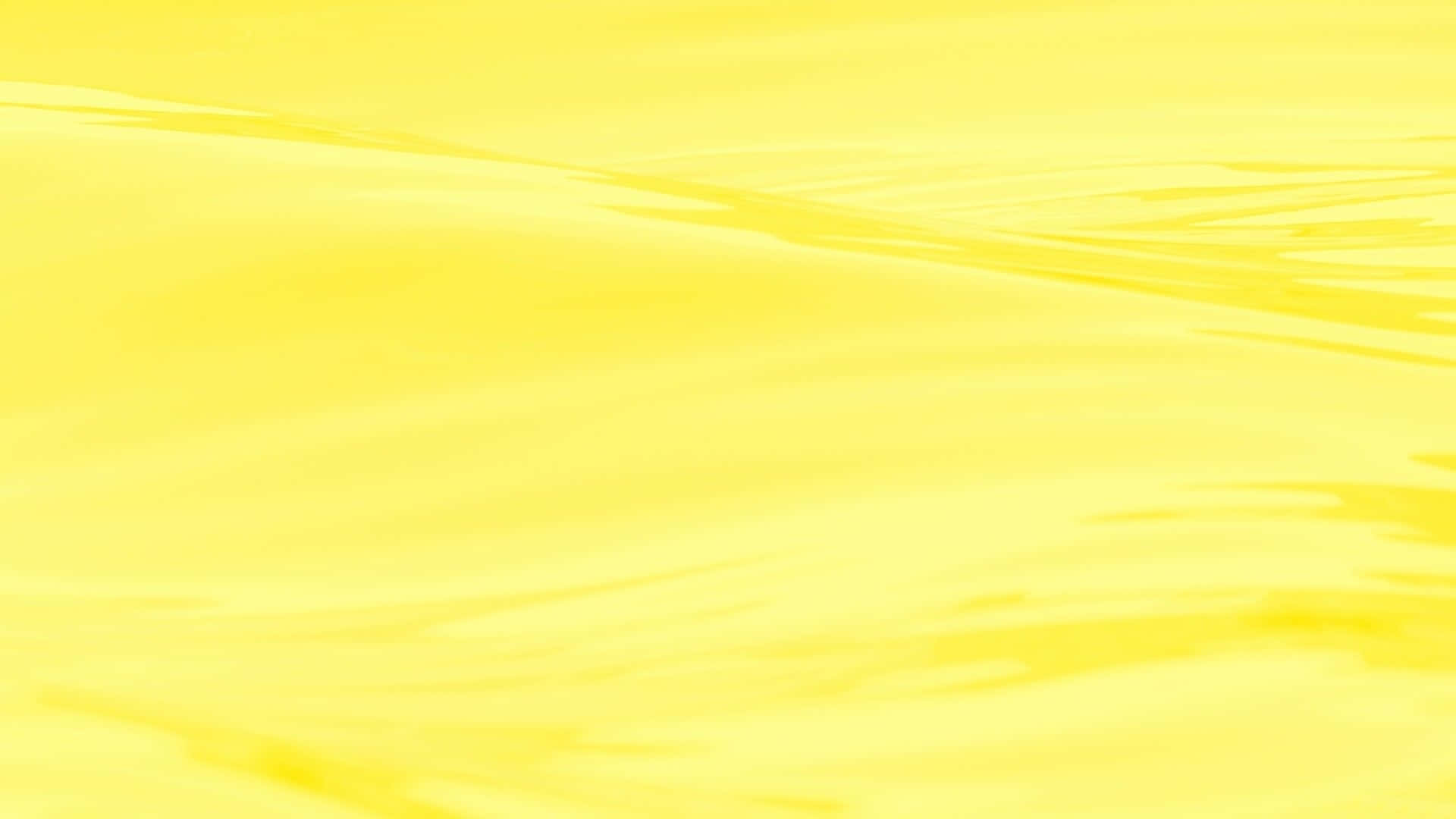 Yellow Aesthetic Desktop 桌布 壁紙 — 柔軟流動的黃色液體表面，帶有輕柔漣漪和順滑漸變，營造出平靜的抽象紋理。