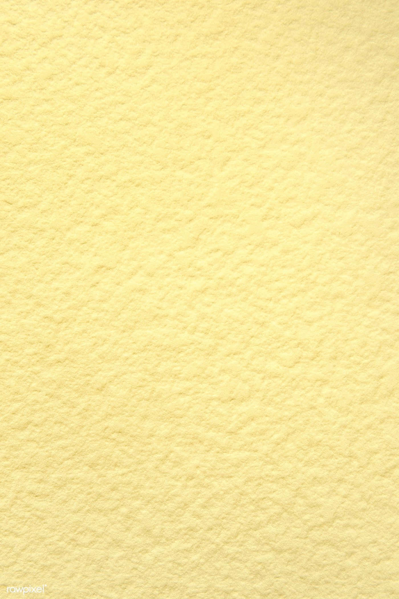 Yellow Texture 桌布 壁紙 — 柔軟淡黃色紋理紙張的特寫，帶有細膩壓花圖案和天然纖維變化。