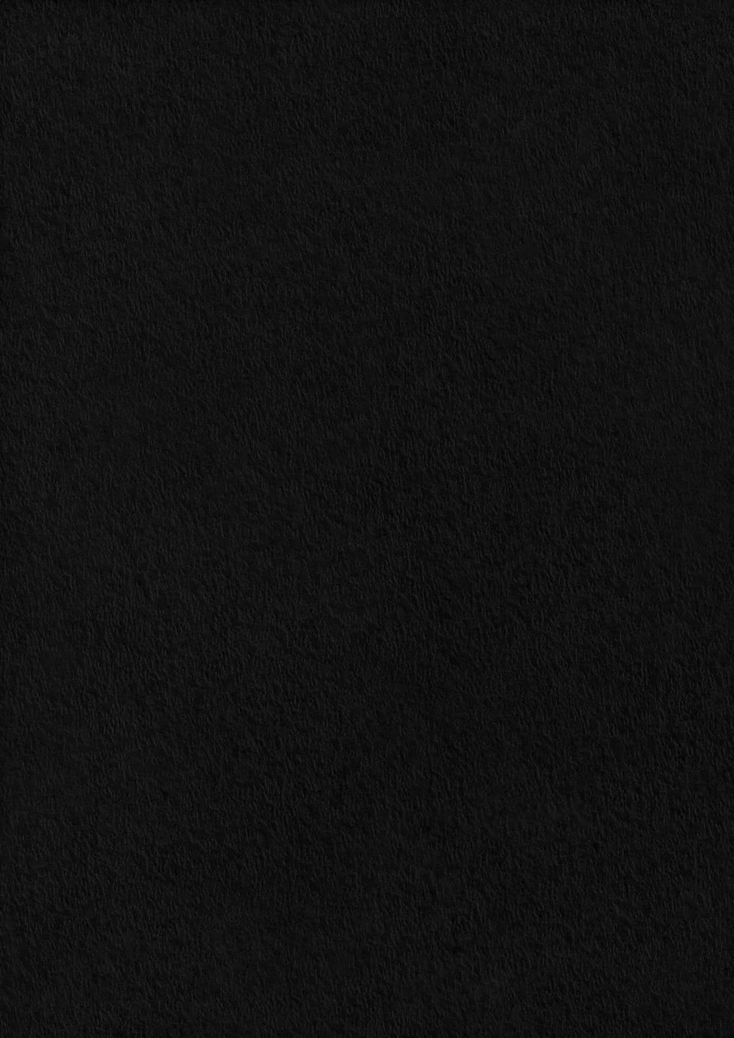 Black Paper Texture 桌布 壁紙 — 柔軟燈光下，帶有細微纖維細節的紋理黑色布料表面特寫。