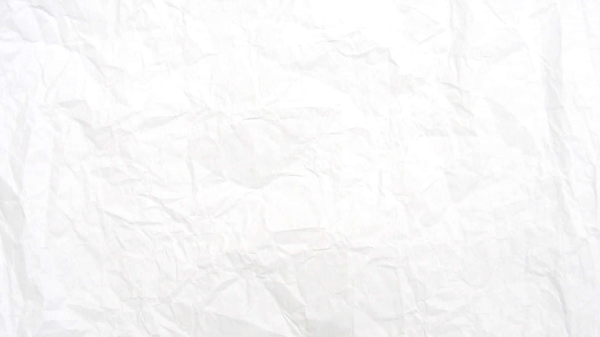 White Plain 桌布 壁紙 — 柔軟白色皺紙的特寫，柔和陰影突出其紋理褶皺。