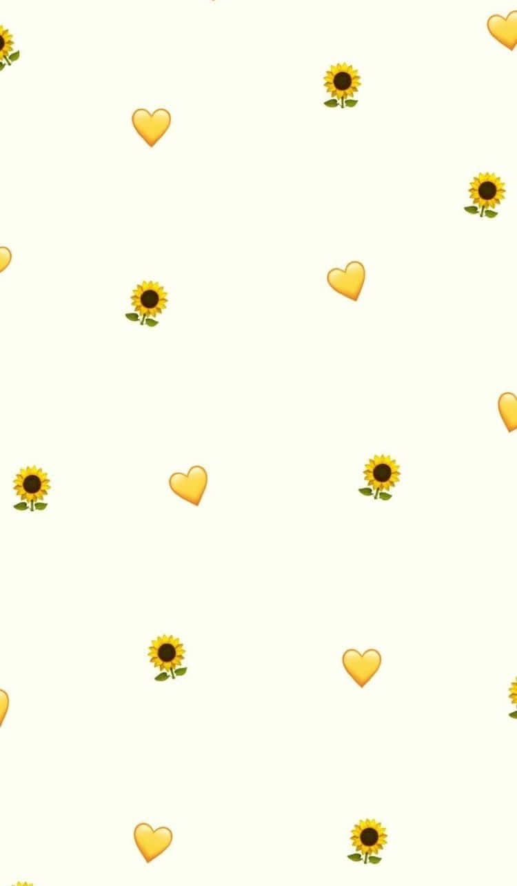 Yellow Heart 桌布 壁紙 — 柔軟的奶油色背景，散落著歡快的黃色向日葵和愛心表情符號，形成俏皮的重複圖案。