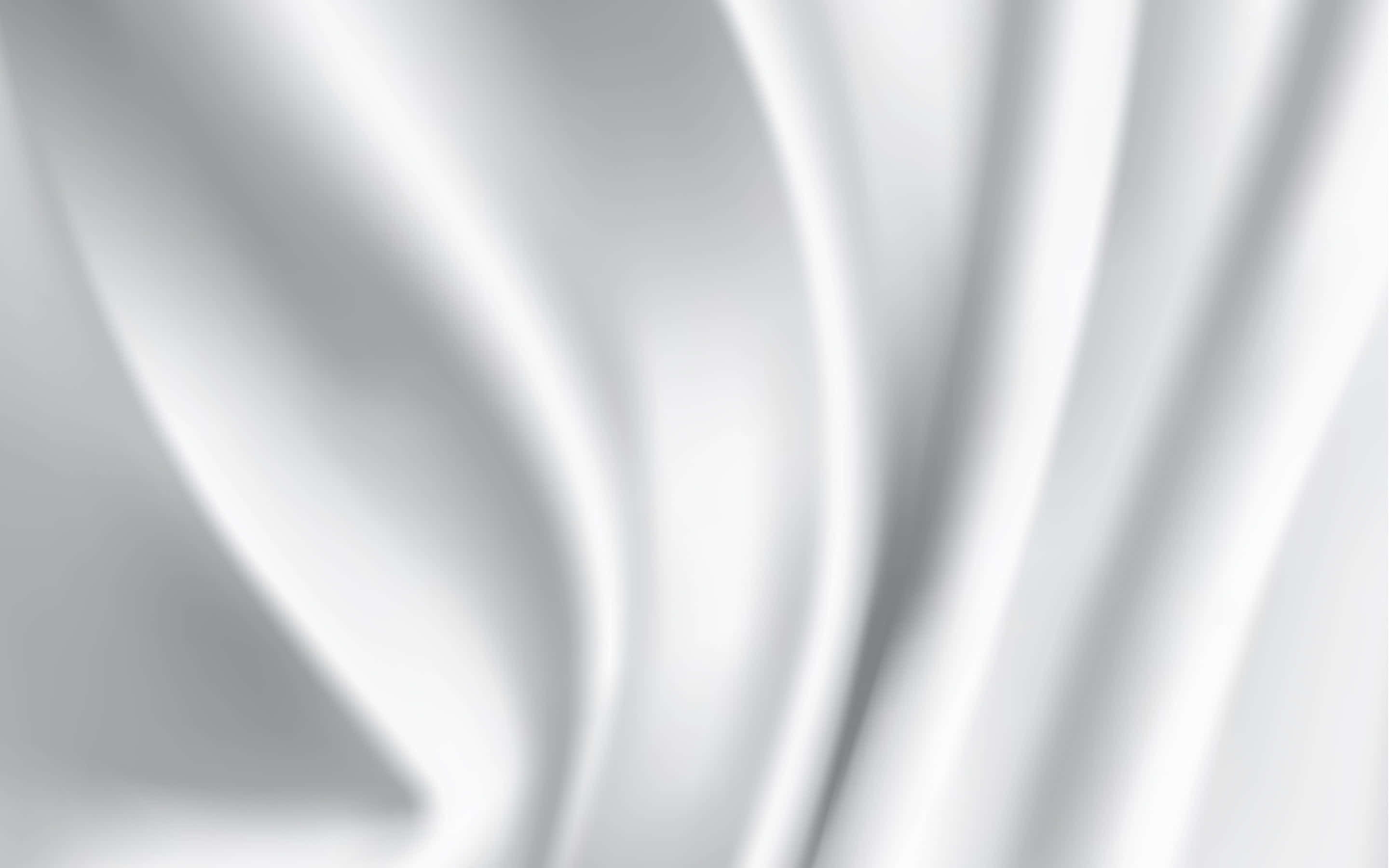 White Texture 桌布 壁紙 — 柔軟的白色絲綢布料以柔和曲線流動，帶有細微陰影，營造出寧靜簡約的質感。