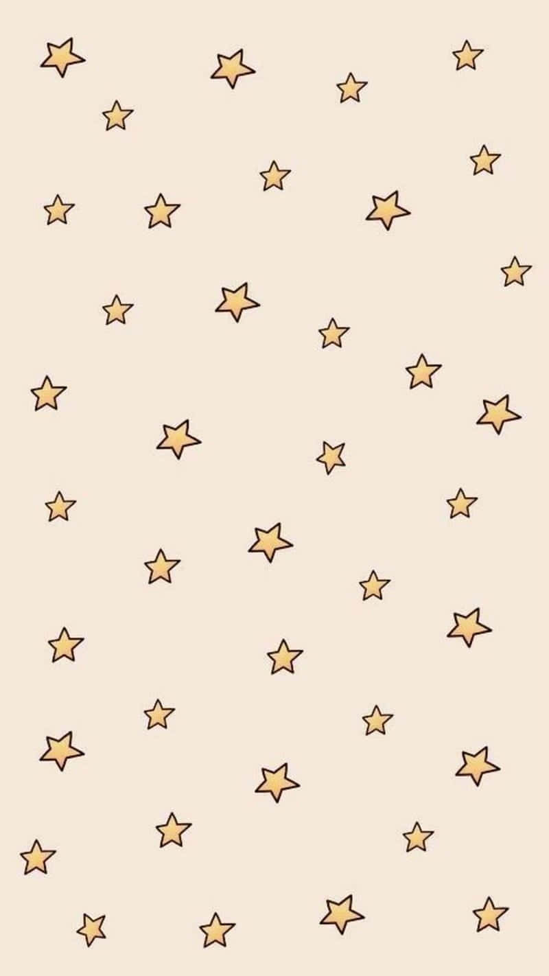 Stars 桌布 壁紙 — 柔軟的米色背景上散佈著手繪金色星星，大小不一。