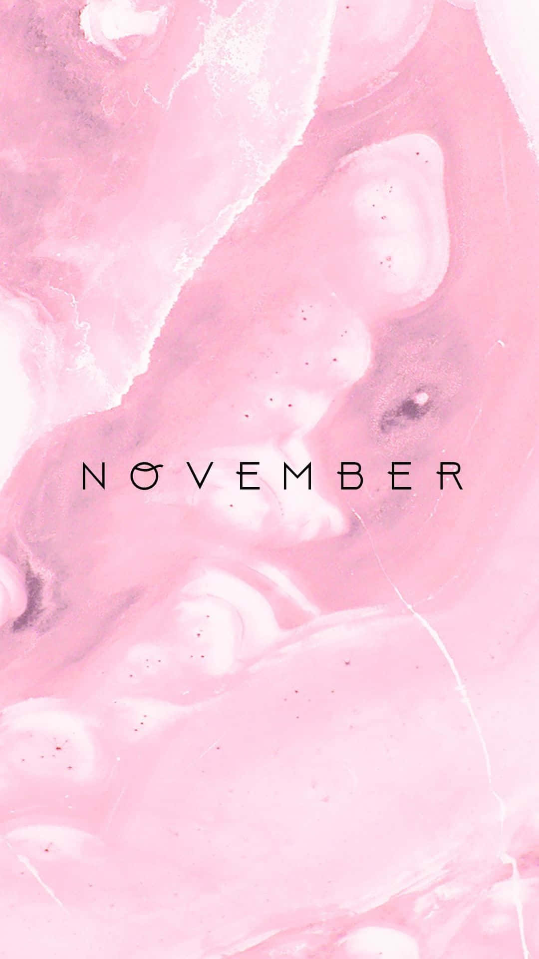 Aesthetic November 桌布 壁紙 — 柔軟的粉紅色和白色抽象大理石紋理，帶有極簡黑色字體的「november」字樣。
