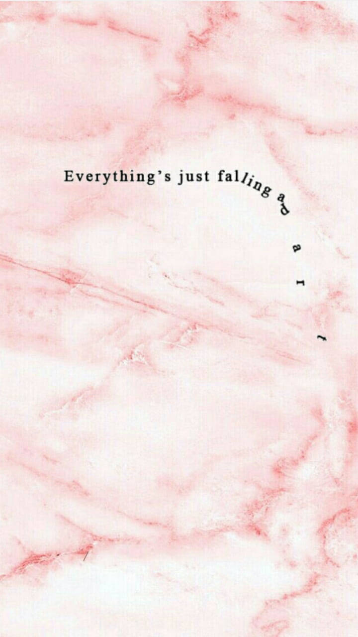 粉紅色 桌布 壁紙 — 柔軟的粉紅色大理石紋理，帶有彎曲的黑色文字「Everything's just falling apart」。