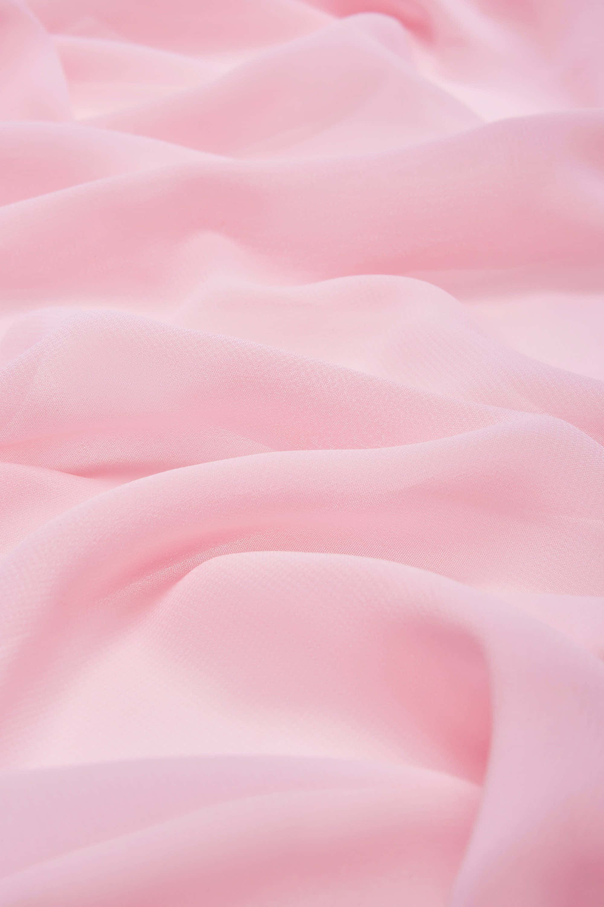 Pink Cotton Candy 桌布 壁紙 — 柔軟的粉紅色布料，帶有柔和的摺痕和細膩質感，以特寫照片捕捉。