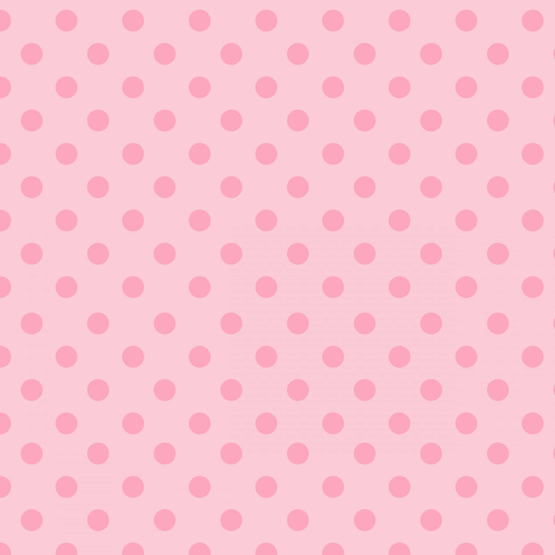 Pink And White Polka Dot 桌布 壁紙 — 柔軟的粉紅色背景，點綴著均勻分佈的淺粉紅色圓點，營造出甜美又俏皮的圖案。