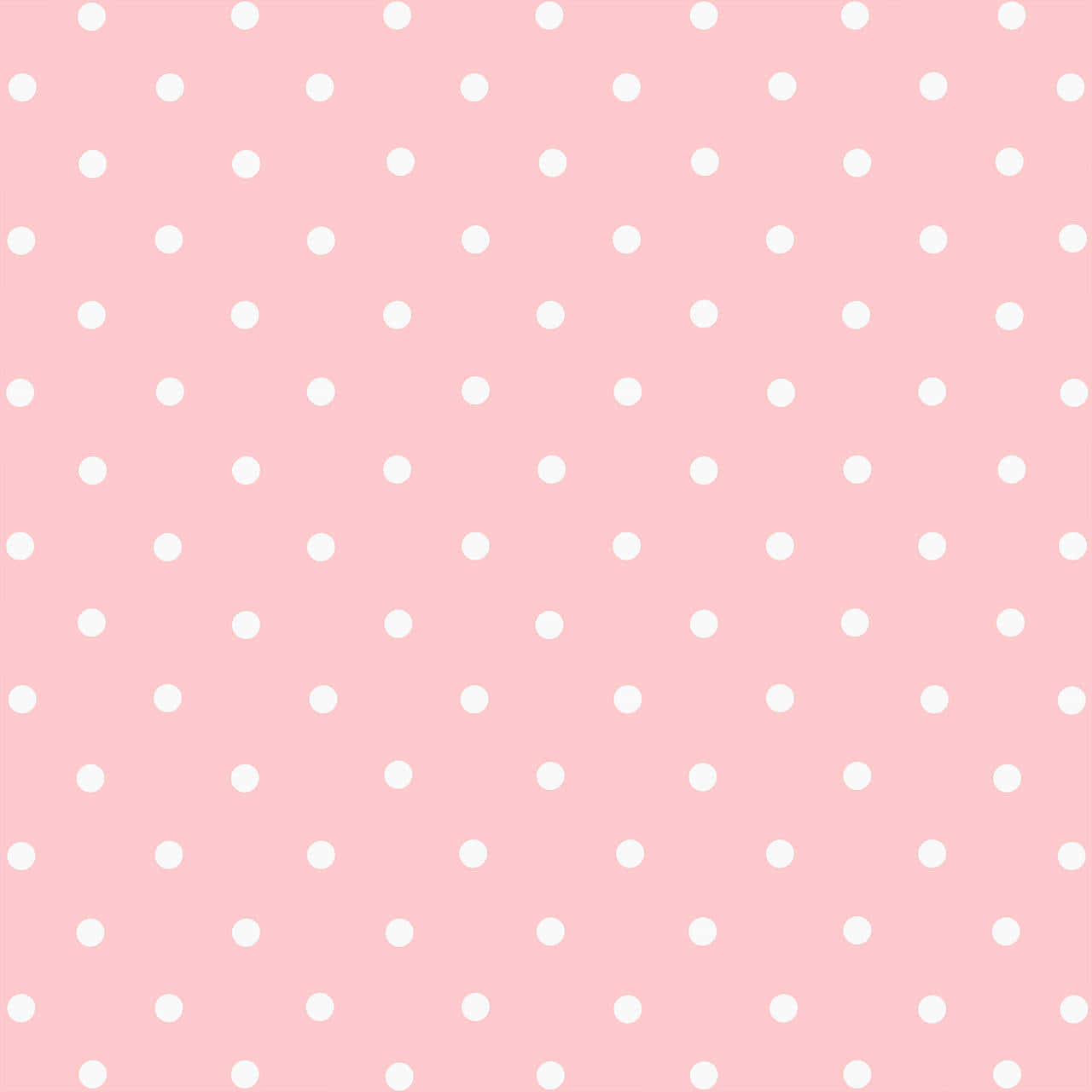Polka Dot 桌布 壁紙 — 柔軟的粉紅色背景上均勻分佈著白色圓點，營造出俏皮甜美的視覺質感。