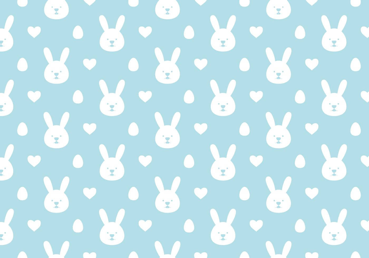 Cute Bunny 桌布 壁紙 — 柔軟的藍色壁紙，帶有重複設計的白色兔臉、心形和蛋形圖案。