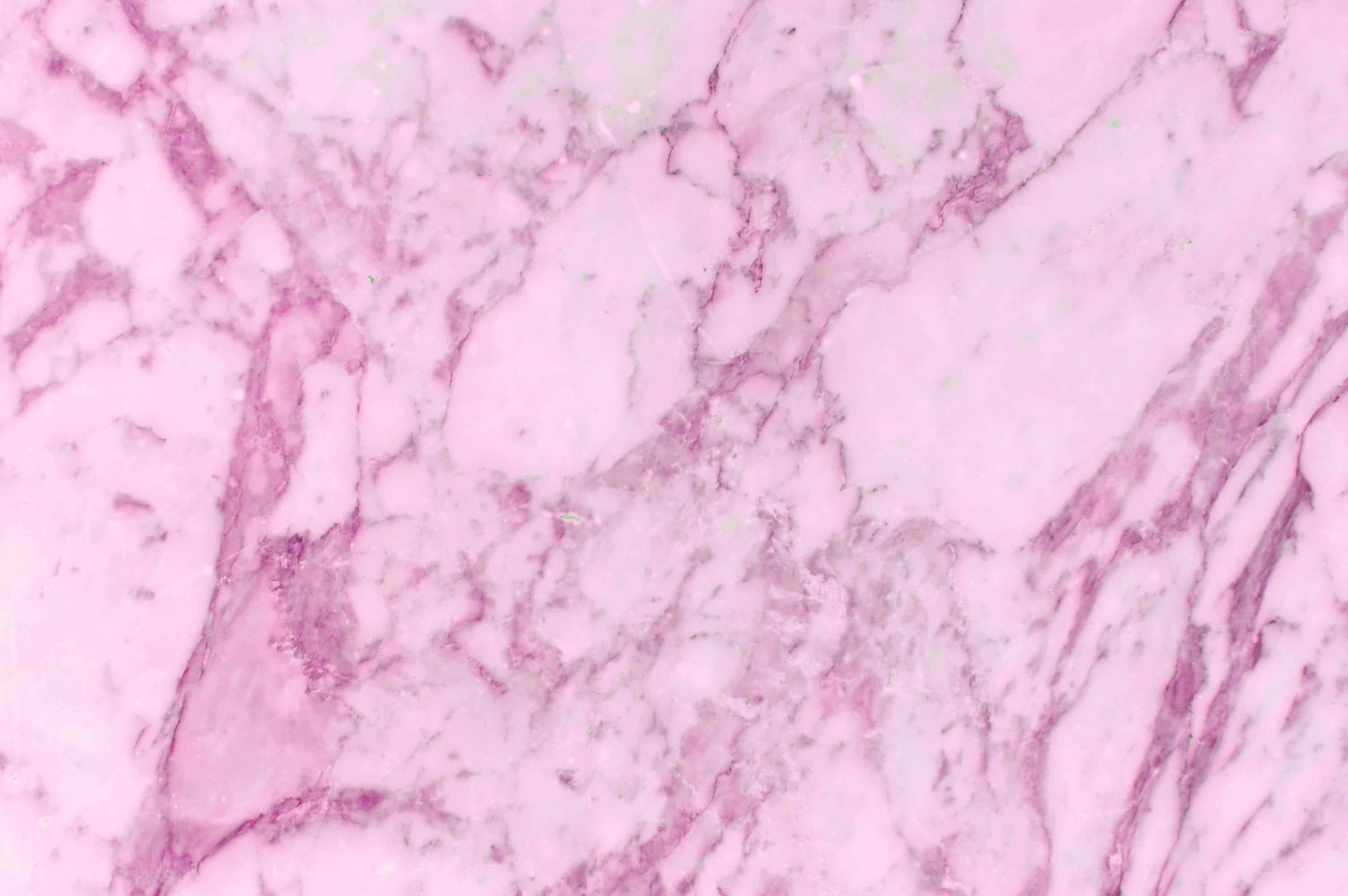 Pink Marble 桌布 壁紙 — 柔軟粉紅色大理石的近距離特寫，帶有深洋紅色和奶油白色的漩渦紋理。