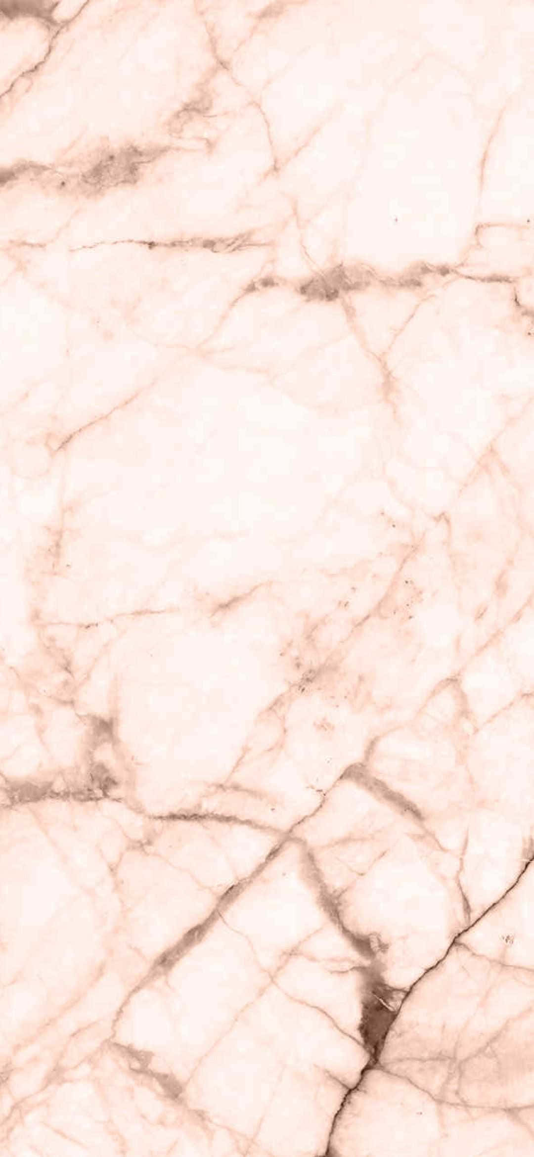 Marble iPad 桌布 壁紙 — 柔軟粉紅色大理石的近距離特寫，細膩的灰色紋理在其光滑表面上流動。