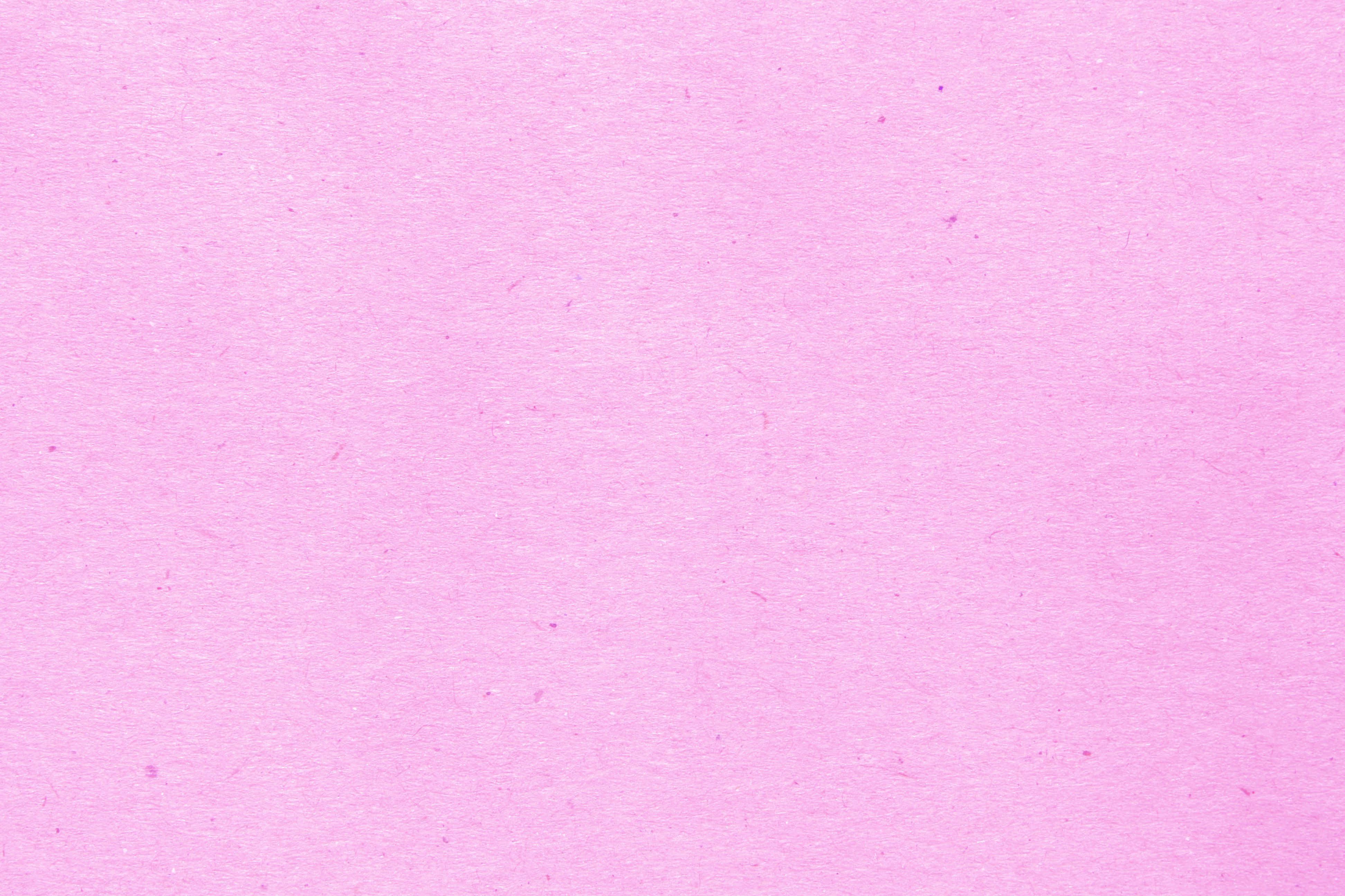 Pink Texture 桌布 壁紙 — 柔軟粉紅色紋理紙張表面，帶有細微纖維和自然瑕疵。