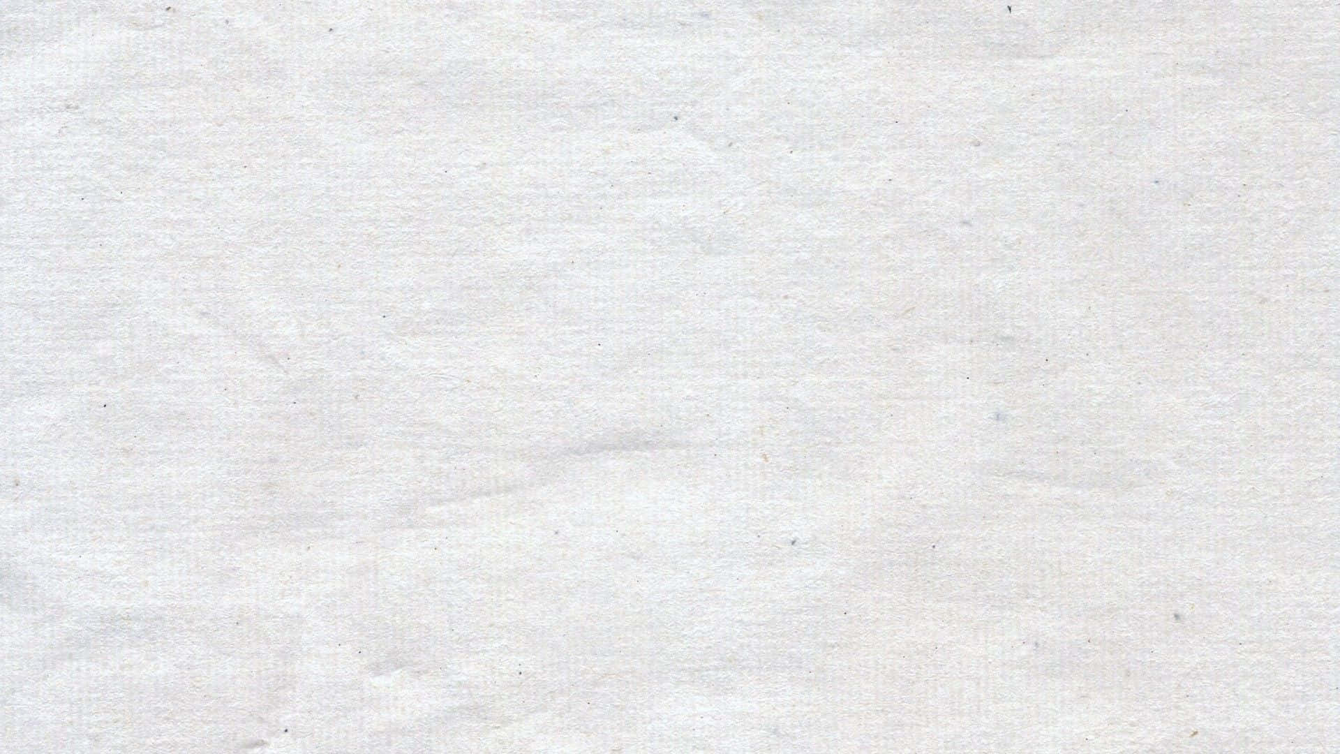 白色美學動圖 桌布 壁紙 — 柔軟紋理白紙的特寫，表面有細微摺痕和淡淡斑點。