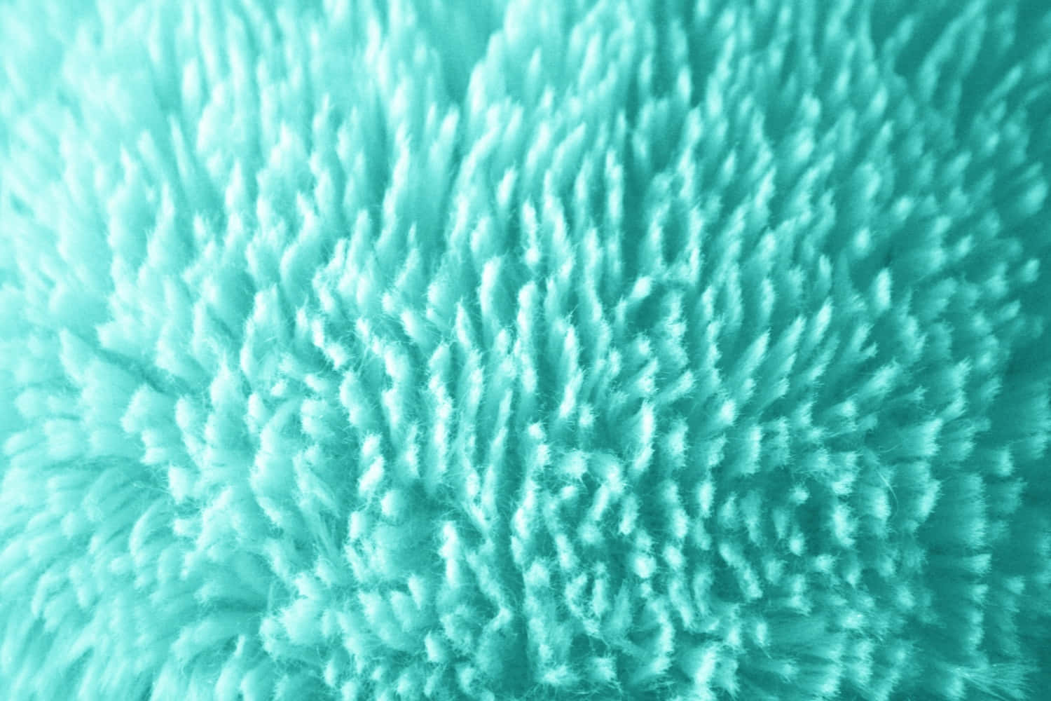 Fabric 桌布 壁紙 — 柔軟蓬鬆的藍綠色布料特寫，紋理纖維營造出舒適的觸感圖案。