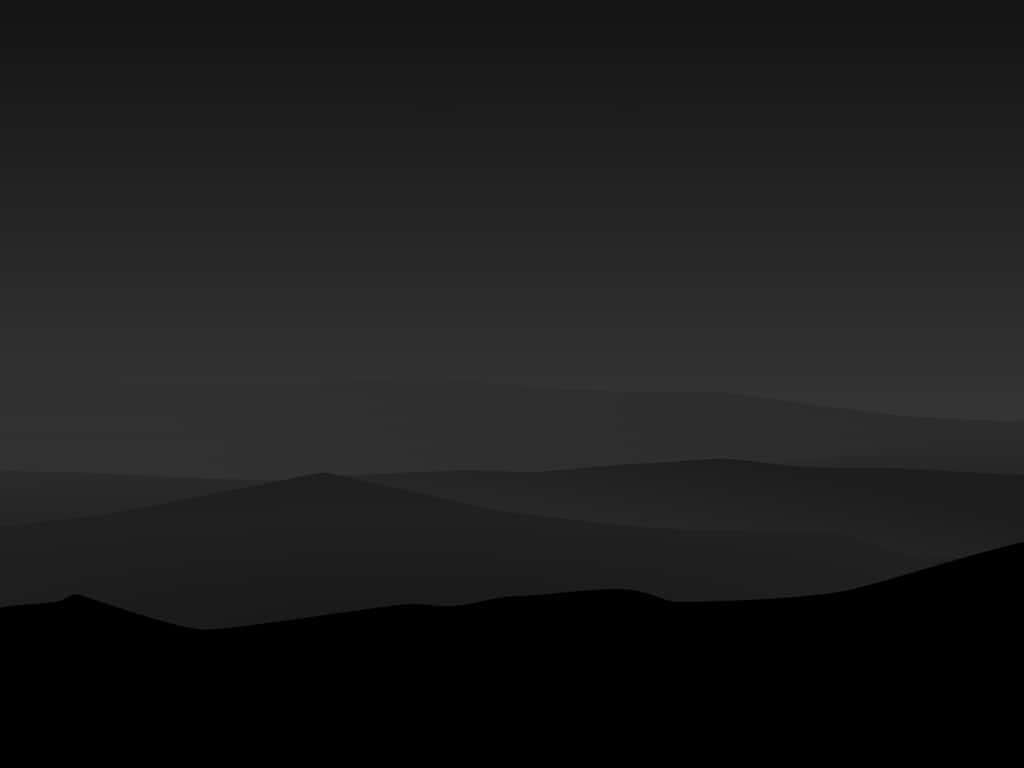 Minimalist Gray 桌布 壁紙 — 極簡單色風景，層疊的山巒剪影逐漸融入漸變的黃昏天空。