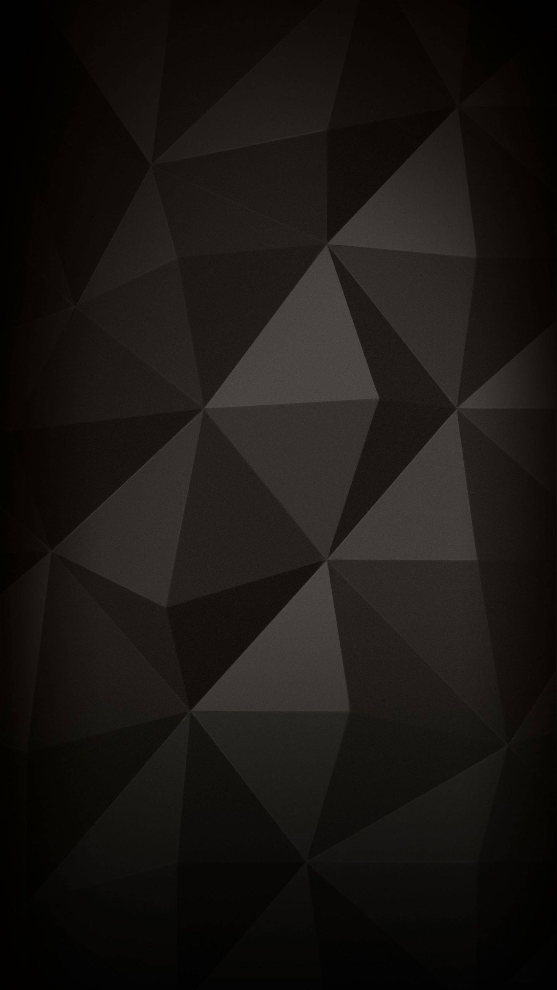 Geometric 桌布 壁紙 — 極簡抽象桌布，以深灰色三角形漸層形成低多邊形幾何圖案。