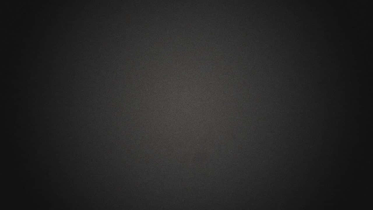 背景 桌布 壁紙 — 極簡深灰色漸變背景，帶有細微紋理和從中心柔和淡出的光線。