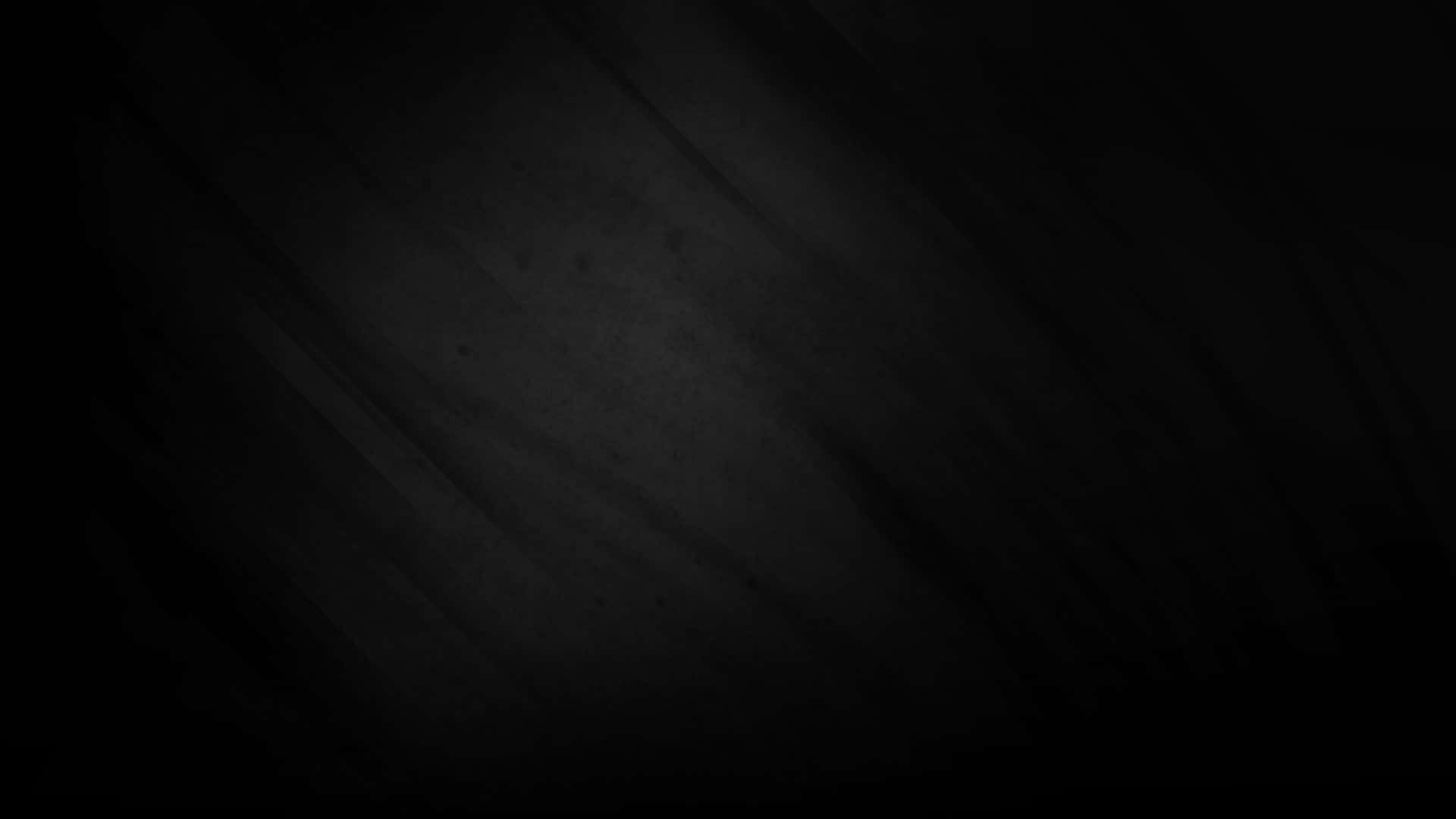 Black Solid 桌布 壁紙 — 極簡深灰色紋理背景，帶有微妙的對角線筆觸和斑點。