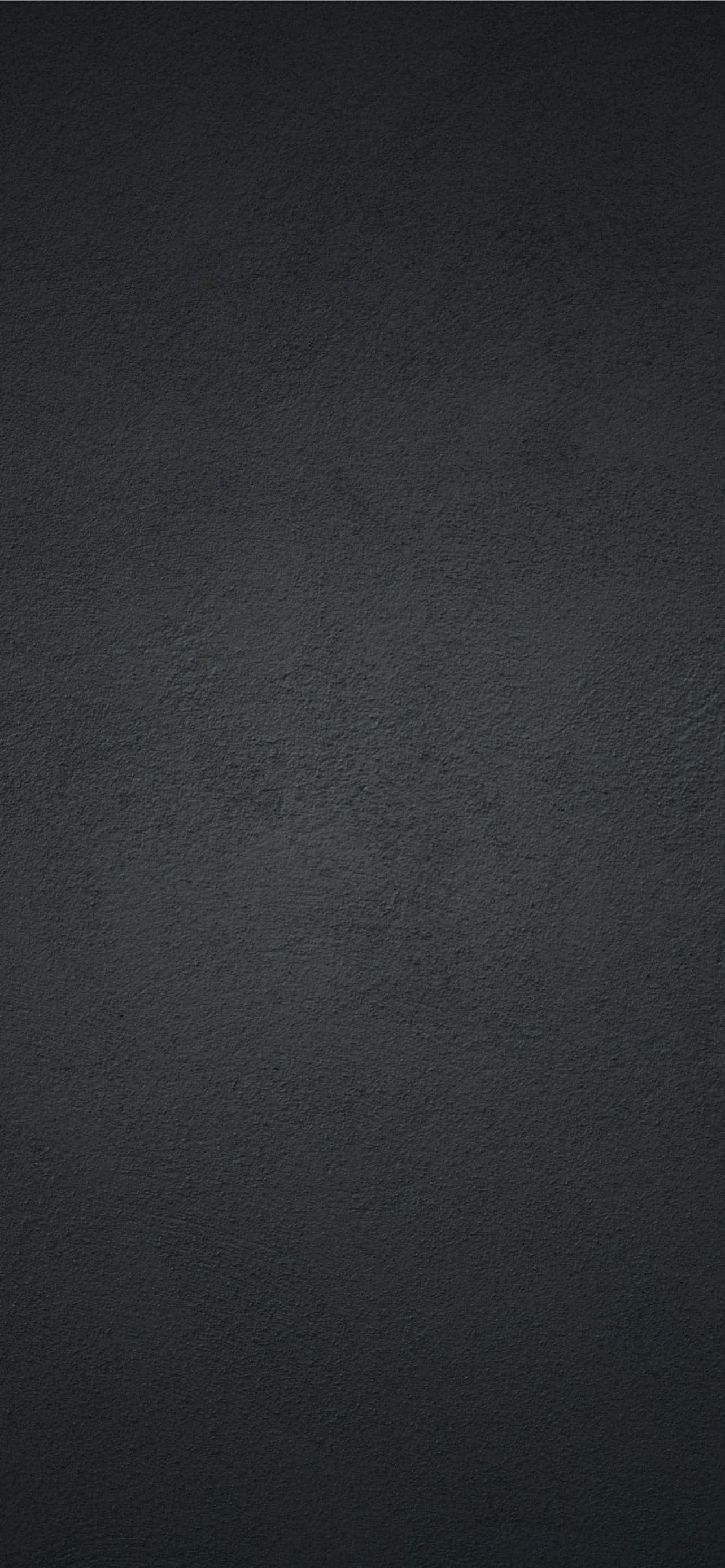 Matte 桌布 壁紙 — 極簡深灰色紋理表面，帶有細微顆粒和柔和漸變燈光。
