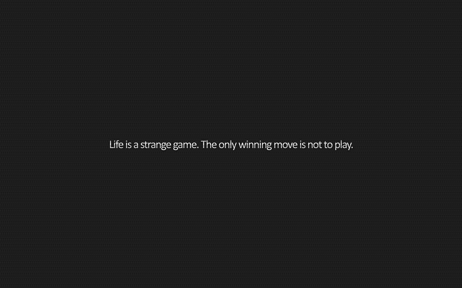 語錄 桌布 壁紙 — 極簡深灰色背景，中央白色文字寫著「Life is a strange game. The only winning move is not to play.」