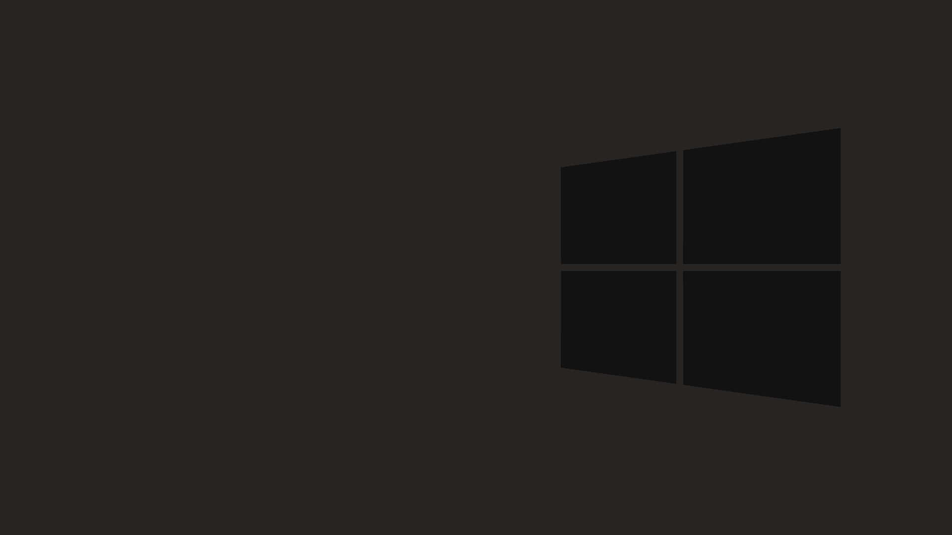 Black Windows 桌布 壁紙 — 極簡深色桌布，Windows 標誌以微妙的灰色呈現，置於純黑背景之上。