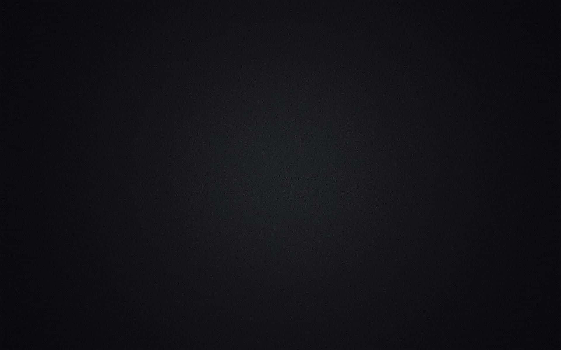 dark black 桌布 壁紙 — 極簡深色漸層背景，帶有細微紋理和柔和中心光暈。