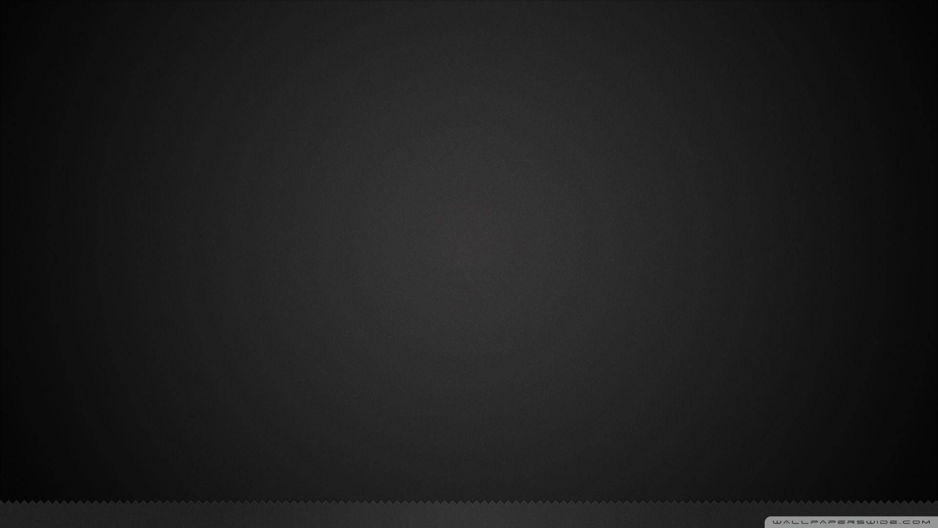 Pure Black 桌布 壁紙 — 極簡漸層黑色桌布，帶有細微紋理和鋸齒狀底部邊緣。